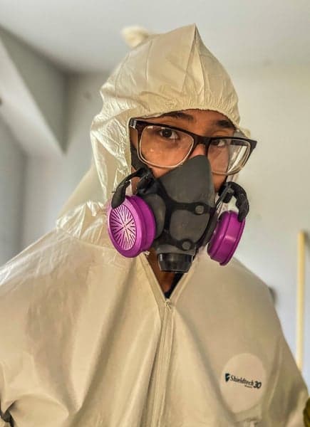 Bulldog technician in full PPE performing mold removal