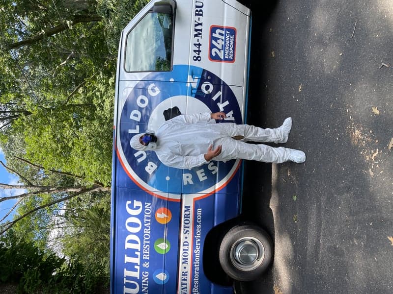 Bulldog Restoration technician performing post-disaster drywall and structural restoration in a Philadelphia home